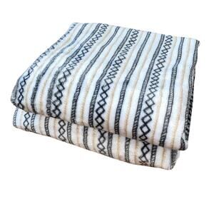 2 Neutral Baby Blankets with an Aztec pattern